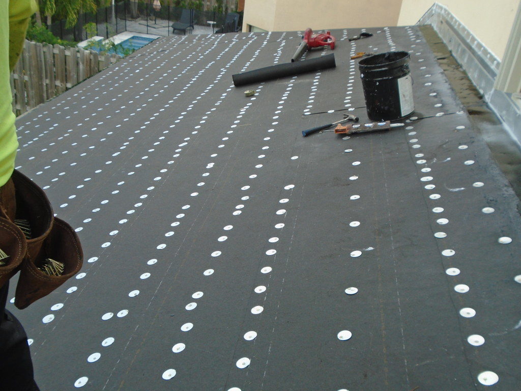 New pitched roof over covered patio