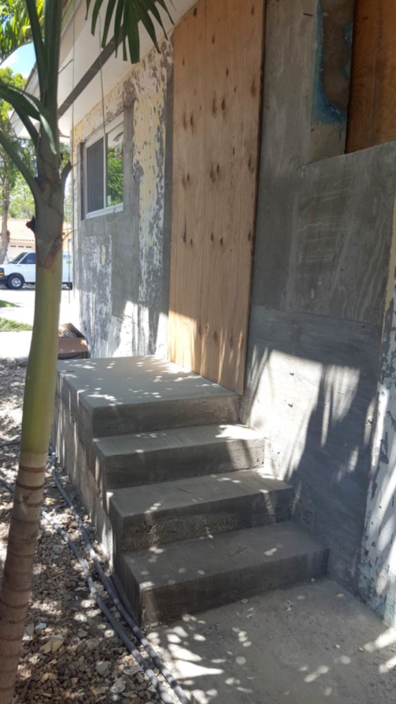 Exterior step for side entrance to converted garage