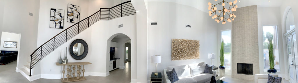 Panoramic photo of foyer and living room