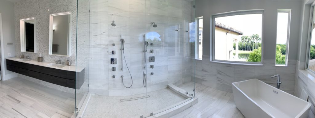 Master bathroom with freestanding tub, glass shower enclosure and double floating vanities