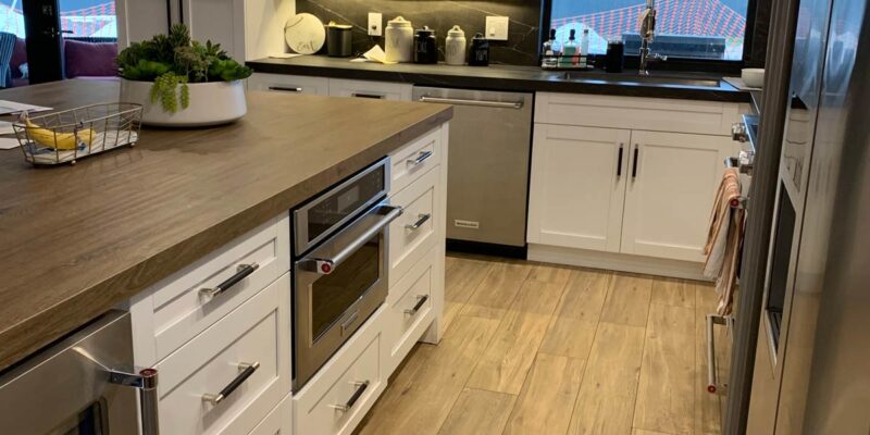 Open concept kitchen with porcelain plank floors