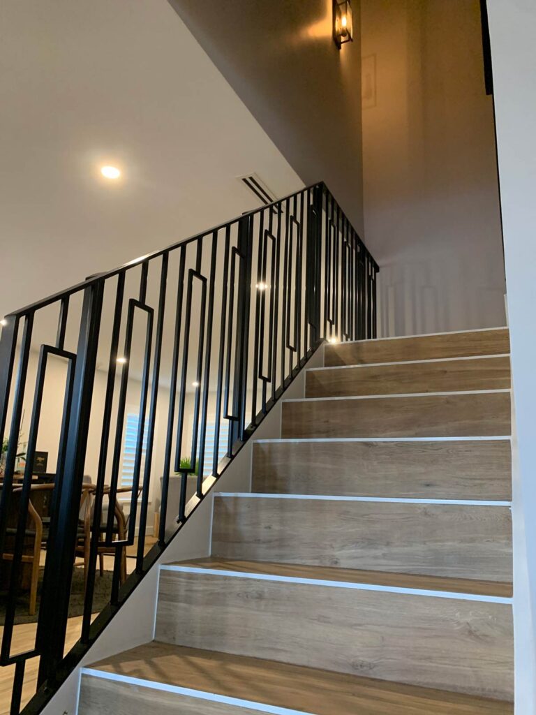 Staircase with porcelain plank tiles on treads and risers