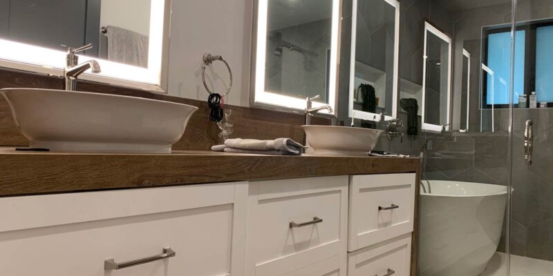 Dual vanity with lighted mirrors