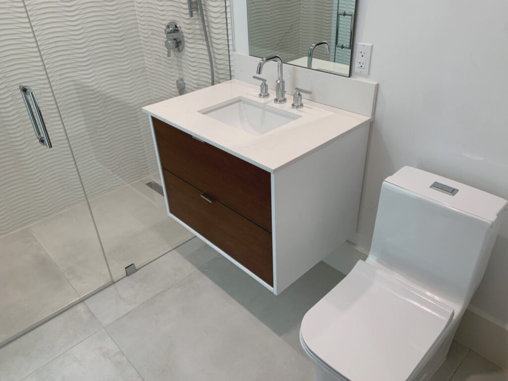 Floating vanity and shower enclosure in cabana bathroom.