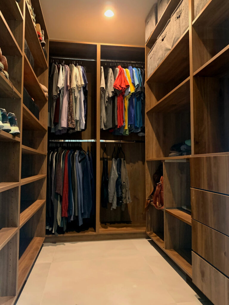 Custom walk-in closet in primary bedroom