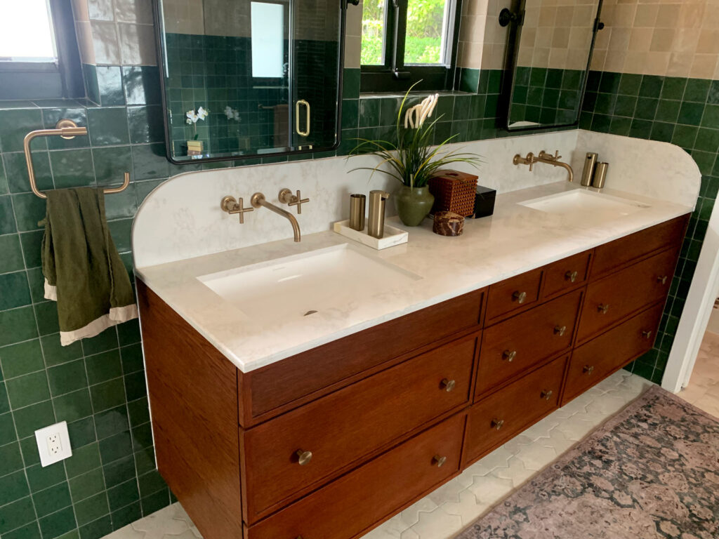 Dual vanity with marble countertop and brass basin taps