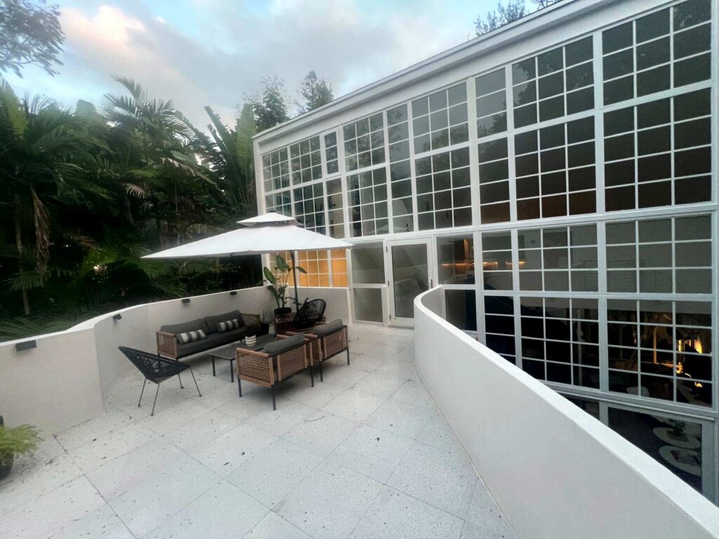 View from rooftop patio towards existing home